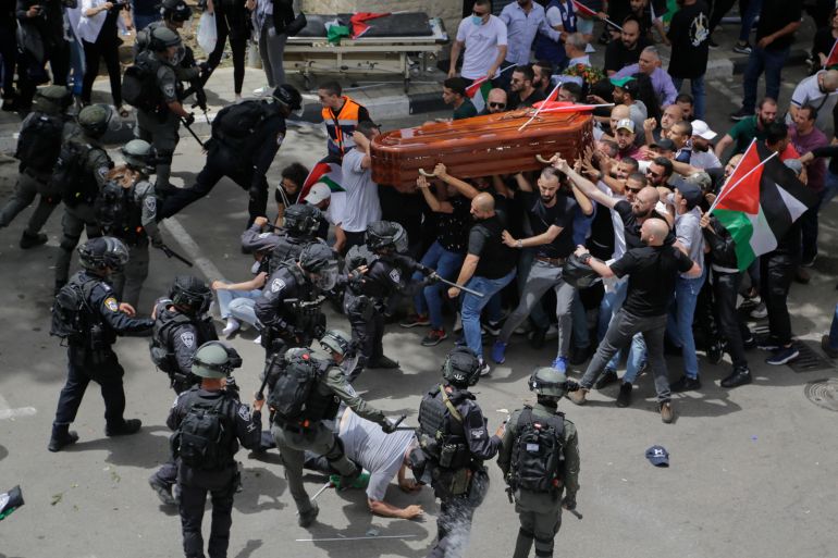 Medics restrained Palestinian journalist Ali al-Samoudi while treating him near slain colleague Shireen Abu Akleh.